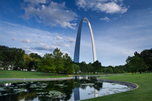 Several trees and a man-made pond in a park. | Parks in St. Louis, MO
